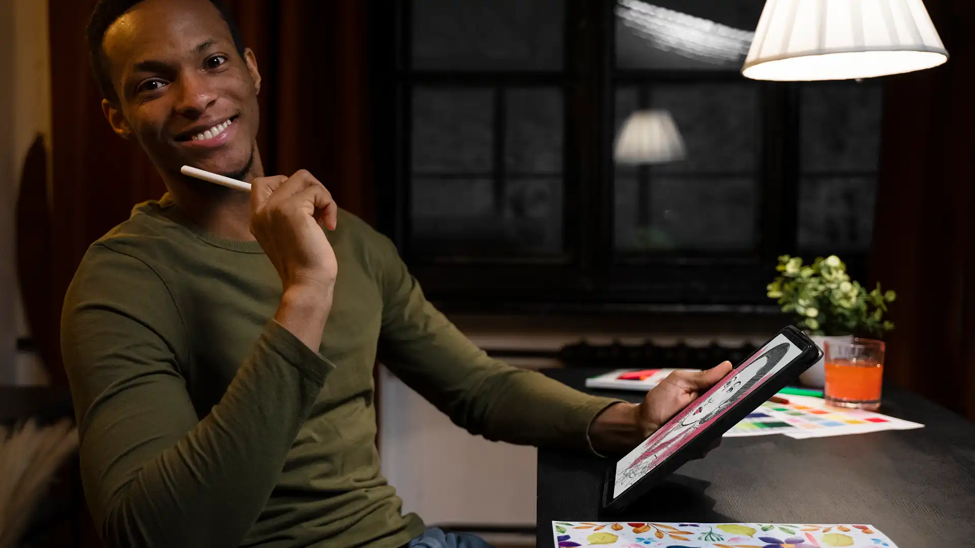 Creative professional reviewing design work on a tablet
