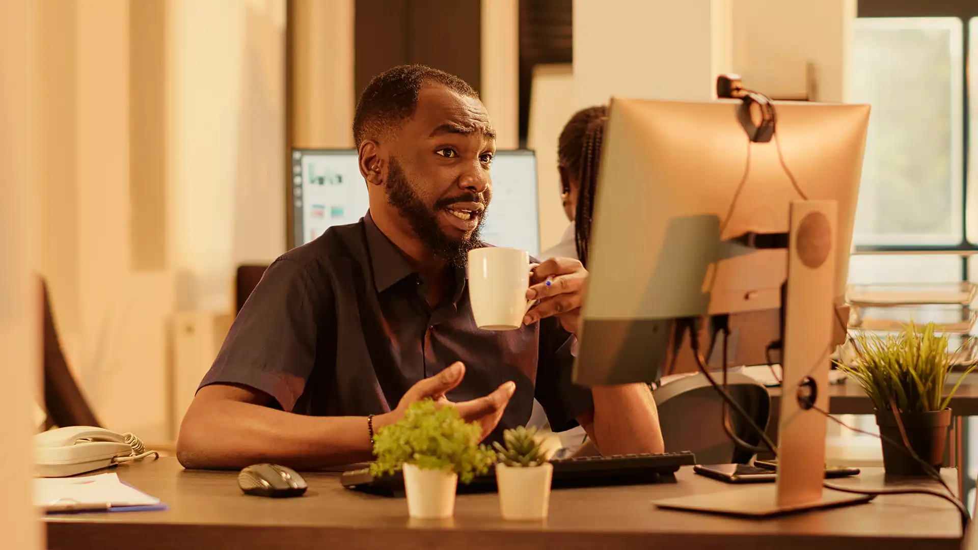 Founder working independently at a desktop workstation