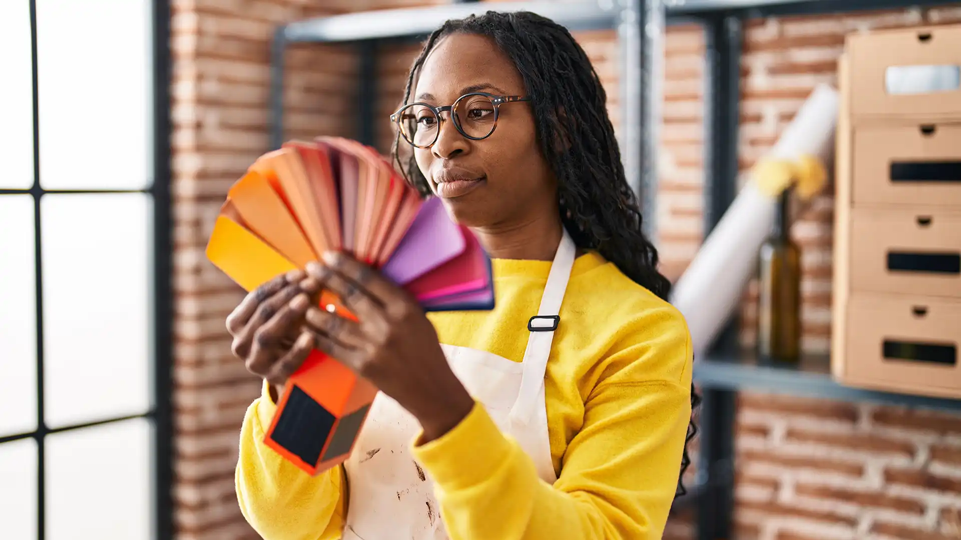 Creative professional reviewing a colourful brand palette