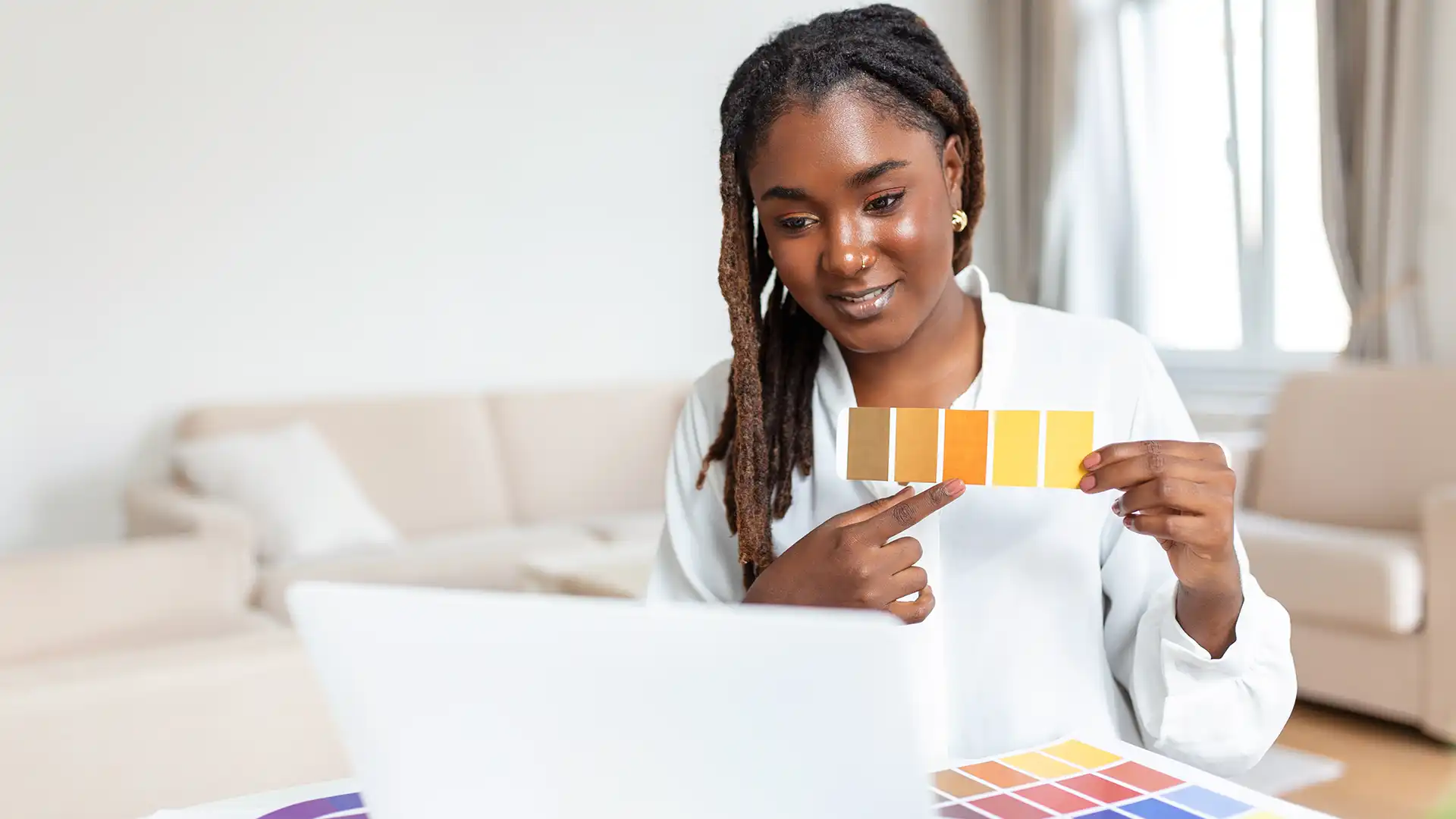 Designer comparing colour samples during a digital brand project