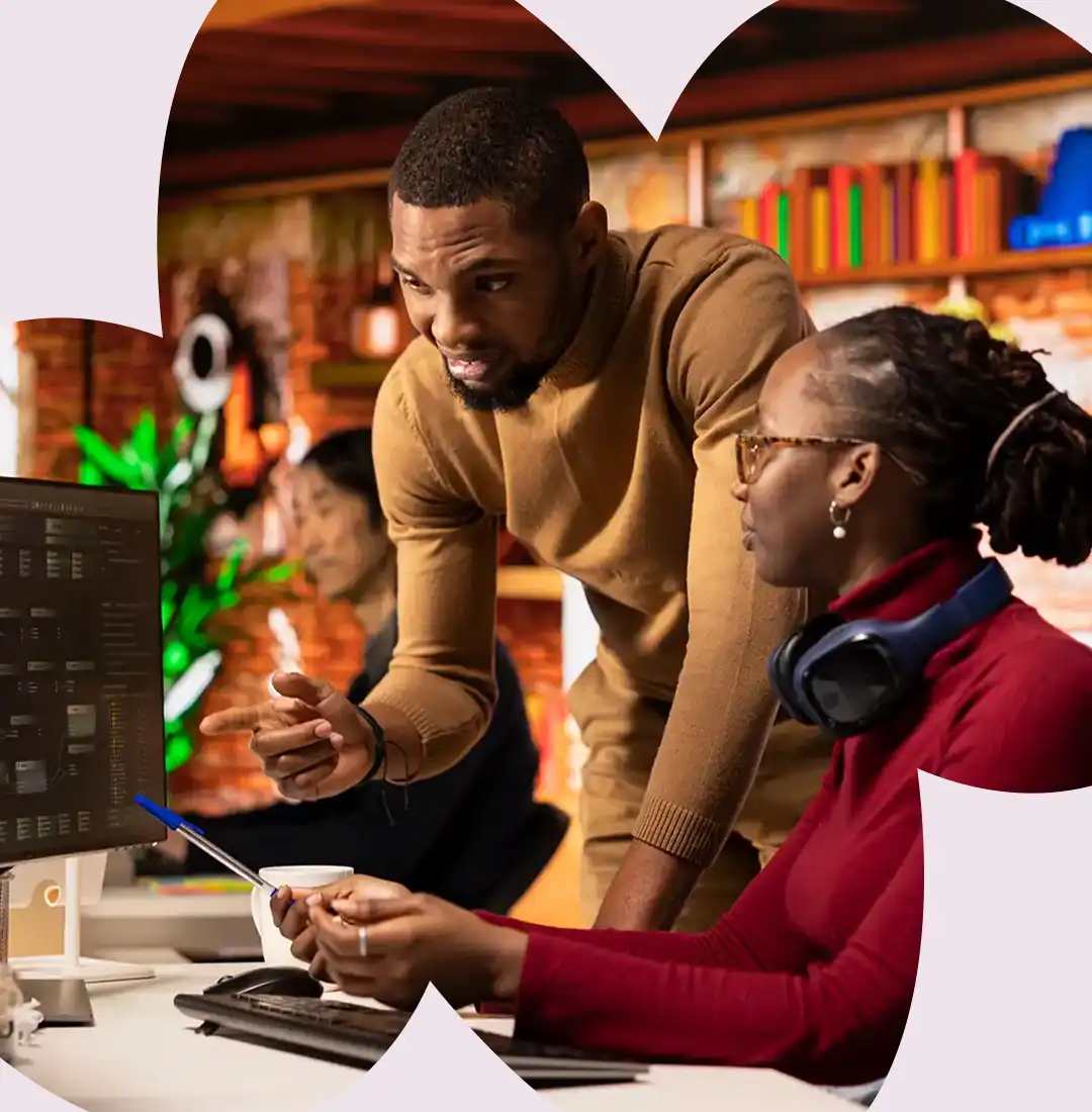 Two people working together at a laptop